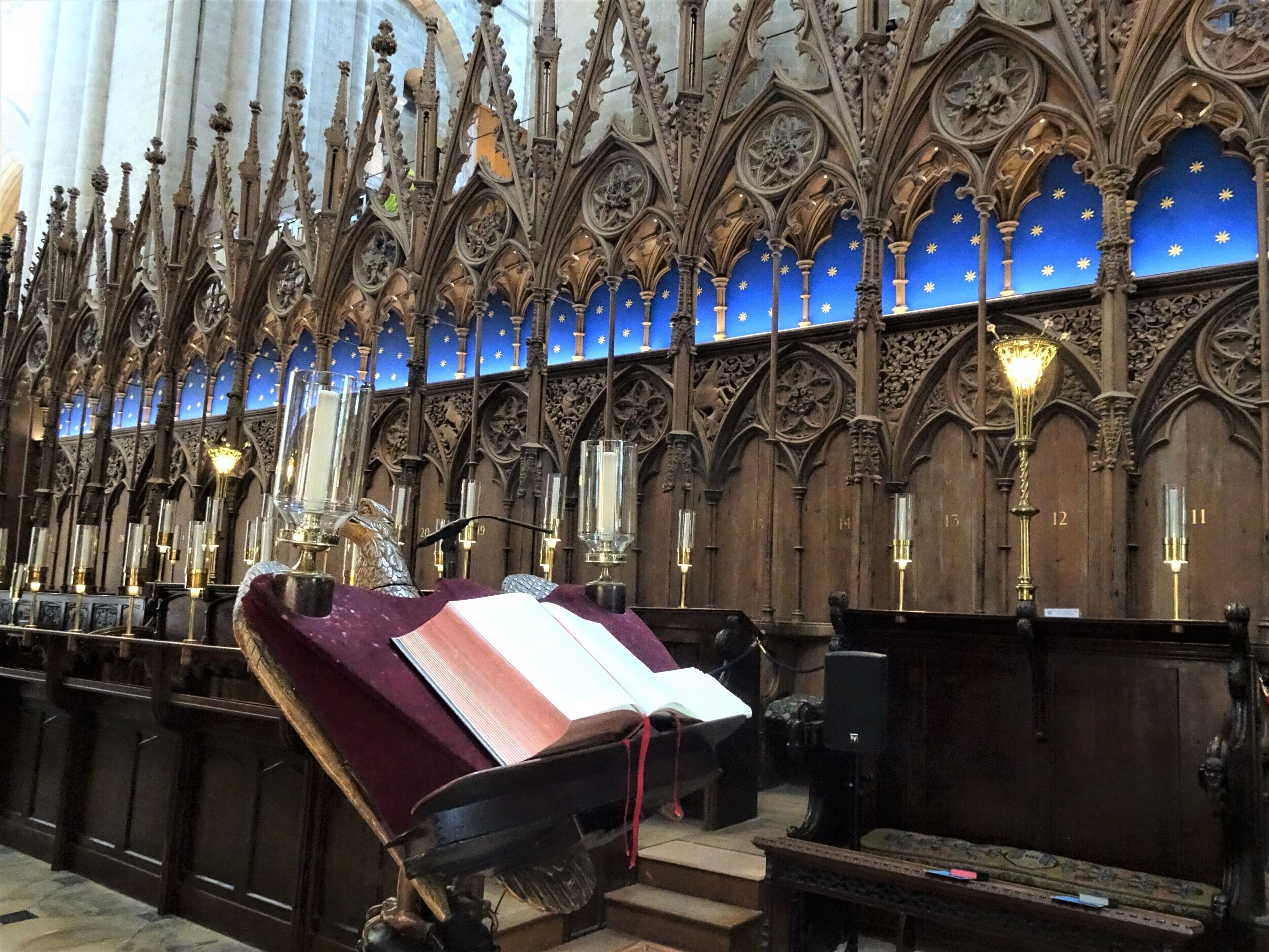 Inside Winchester Cathedral.
These exquisite early 14th-century oak choir stalls, where the priory monks once sang their daily offices, are an outstanding survival. Richly decorated with human figures, tiny heads and carved animals surrounded by luxuriant curling leaves, they are thought to be the work of a Norfolk craftsman and master carpenter.