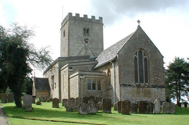 A church with a tower and a graveyard.