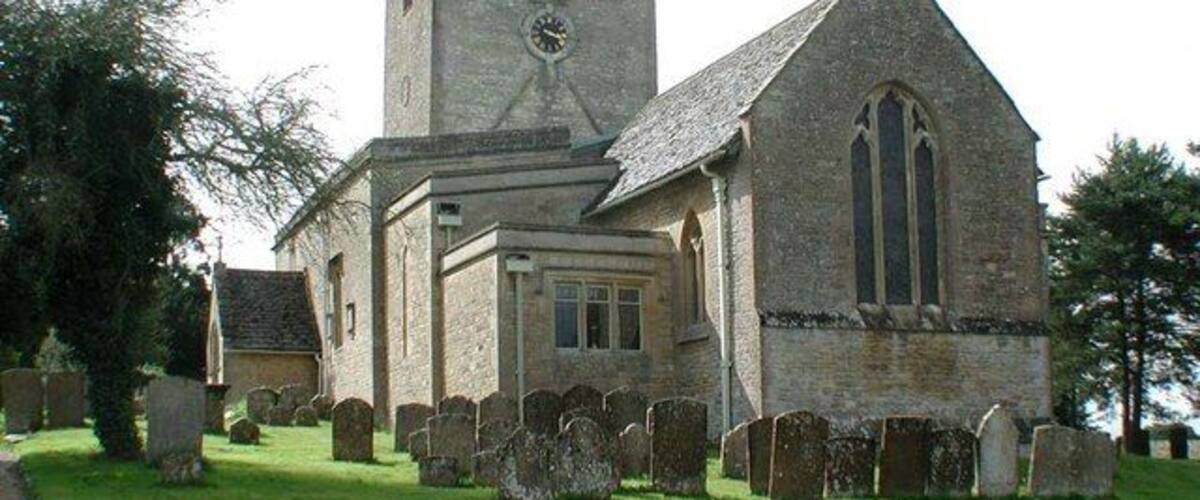 A church with a tower and a graveyard.