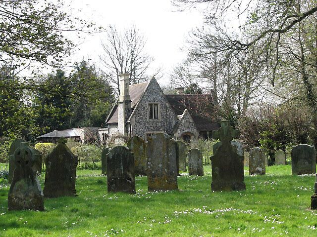 School Lodge. A gatehouse at the entrance to Kimberley Hall, viewed from across the churchyard of > 773232.