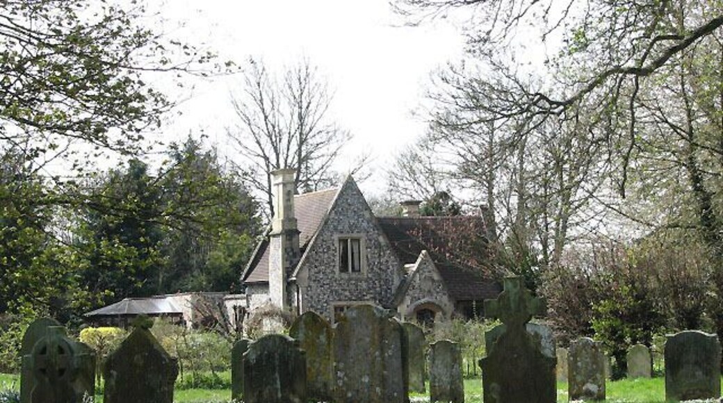 School Lodge. A gatehouse at the entrance to Kimberley Hall, viewed from across the churchyard of > 773232.