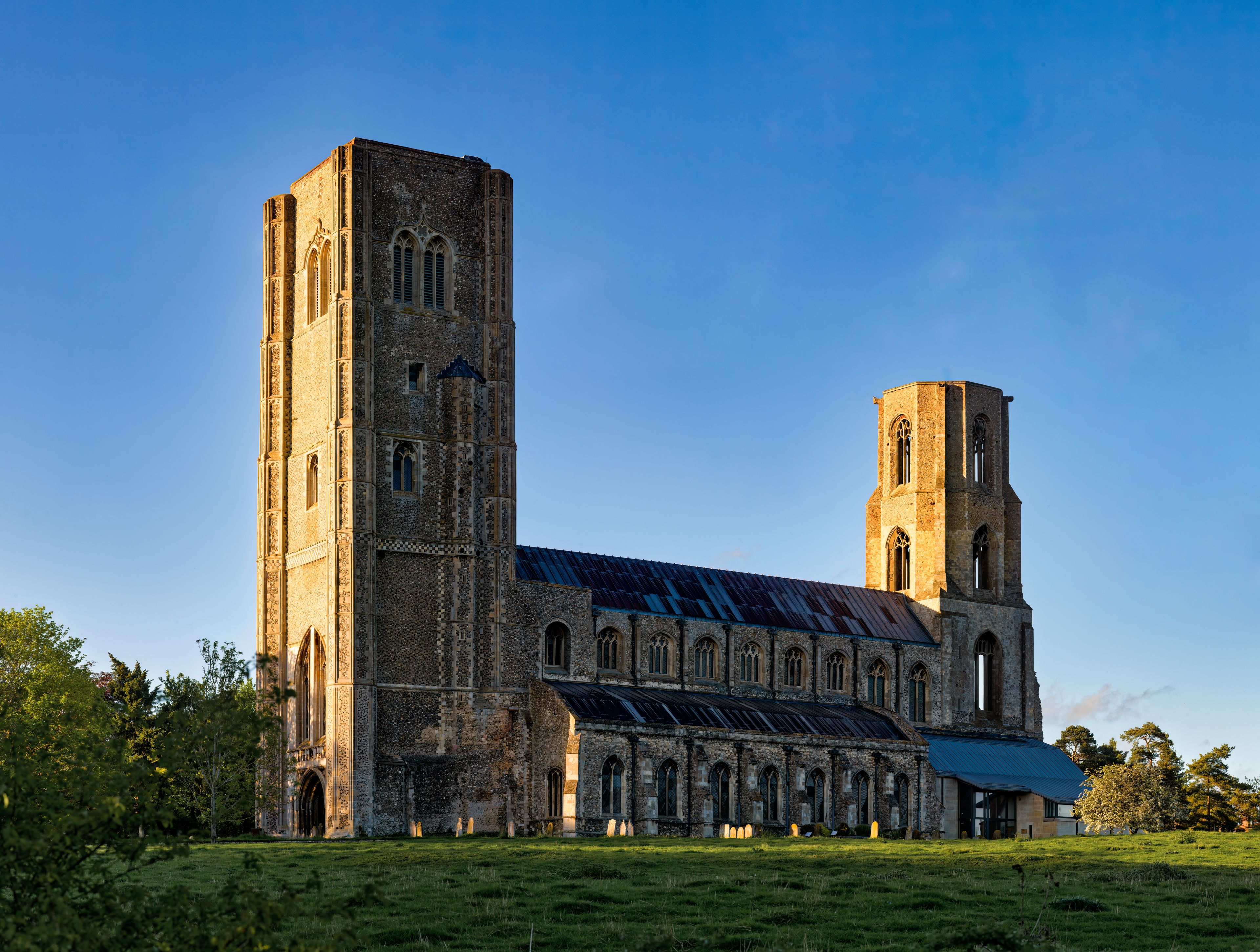 A large, historic church with two prominent towers and a large arched entrance.