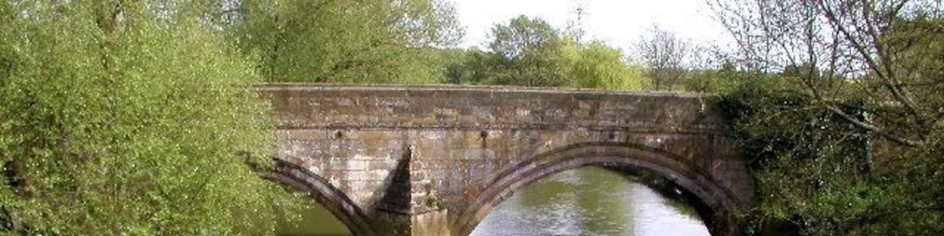 The old Kexby Bridge over the River Derwent forming the boundary between North Yorkshire and the East Riding of Yorkshire, England. MR: SE705511