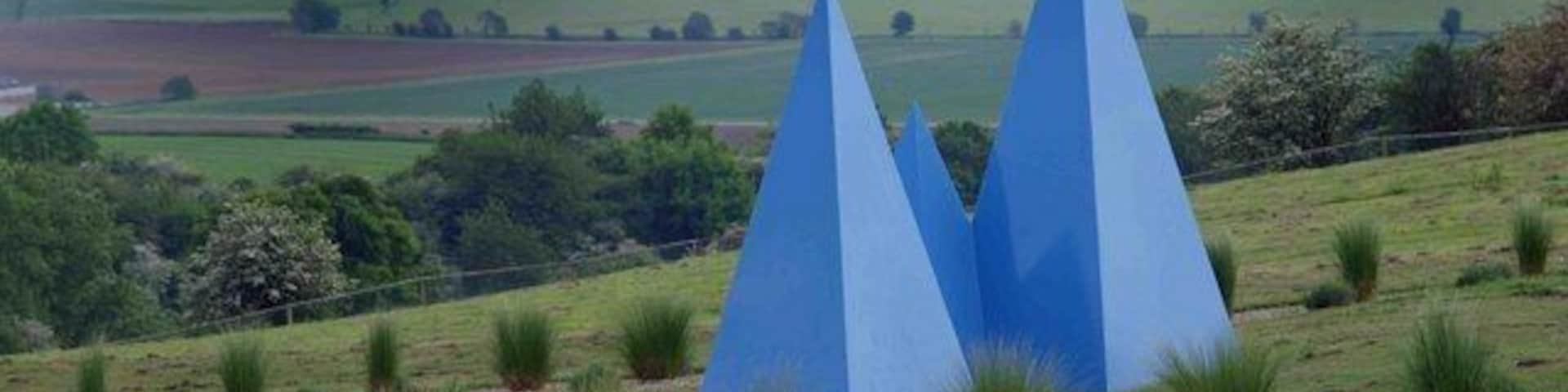 Pyramid sculptures overlooking the Vale of York From the car park at the Yorkshire Lavender Farm.