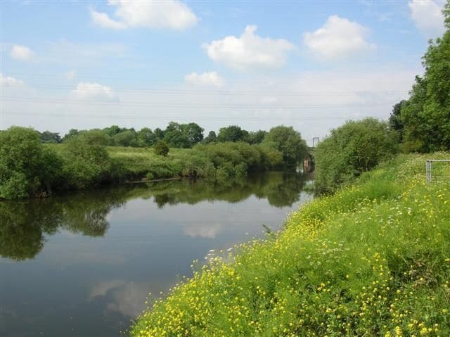 Ouse - Skelton Bridge. River Ouse from the east bank. Skelton bridge can be seen, carrying the railway over the river.