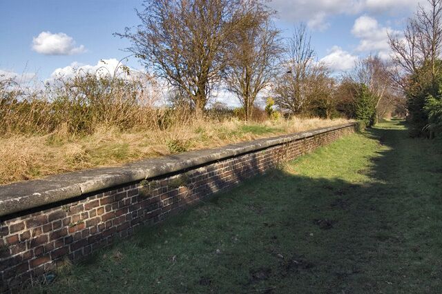 Former station, Holme-on-Spalding-Moor, East Riding of Yorkshire, England. The platform seen here, and the former station house (now residential, to the right of this shot) are all that remain of the station. It was on the Market Weighton and Selby branch of the North-Eastern Railway, the trackbed of which now forms the Howdenshire Rail Trail, a nine-mile stretch of permissive bridleway.