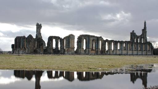Reflection of history Byland Abbey in North Yorkshire reflected in the flood water of the adjoining field.