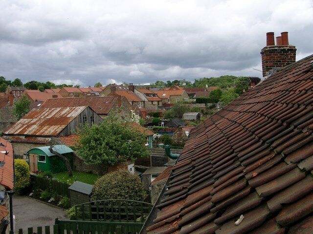 Gardens and roofs behind West End and Tinley Garth Showing the older mix of buildings and the new roofs of Tinley Court to the left. A traditional pan-tile roof is shown on the right.