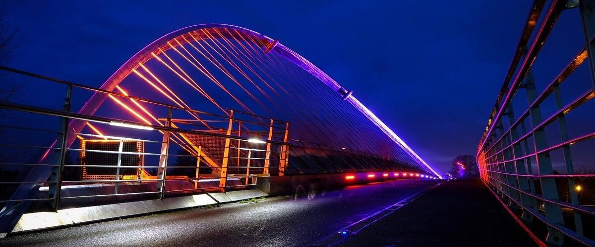 The Millennium Bridge over the River Ouse is li up at night with coloured LEDs. #yorkshire #york #riverouse #Bridge #illuminated