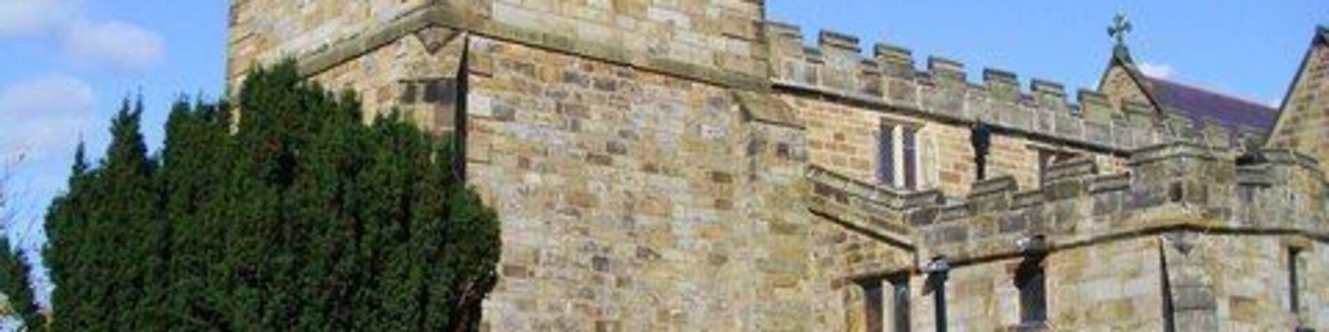 All Saints, Kirkbymoorside. View of the church from the south west, showing the mostly 18thC tower.