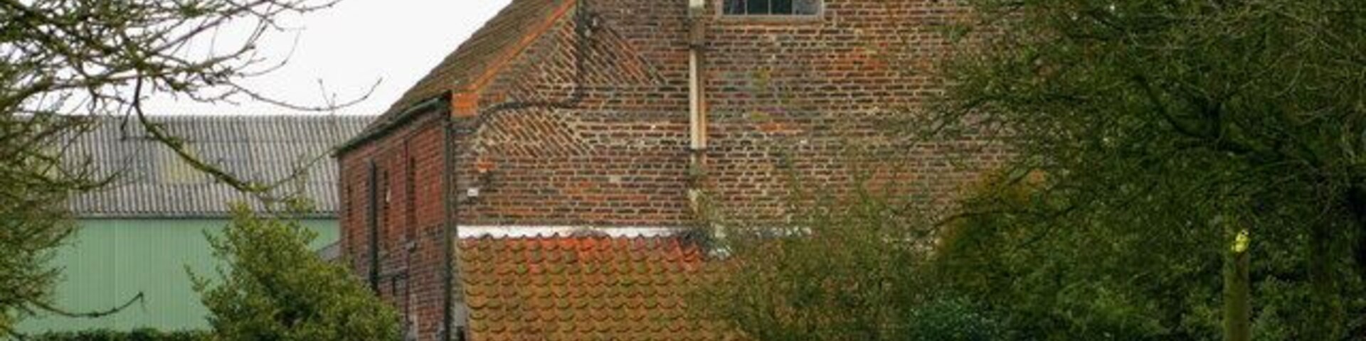 Low Riseborough Farm Viewed from the footpath running through the orchard.