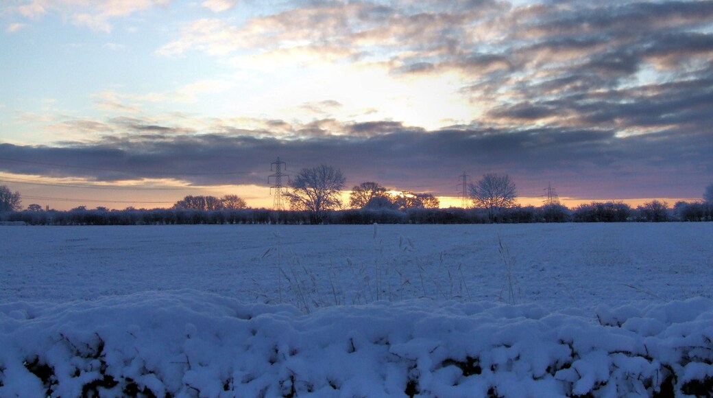 Snowy Sunset at Wilberfoss, East Riding of Yorkshire, England. Taken from the A1079 towards the A1079.