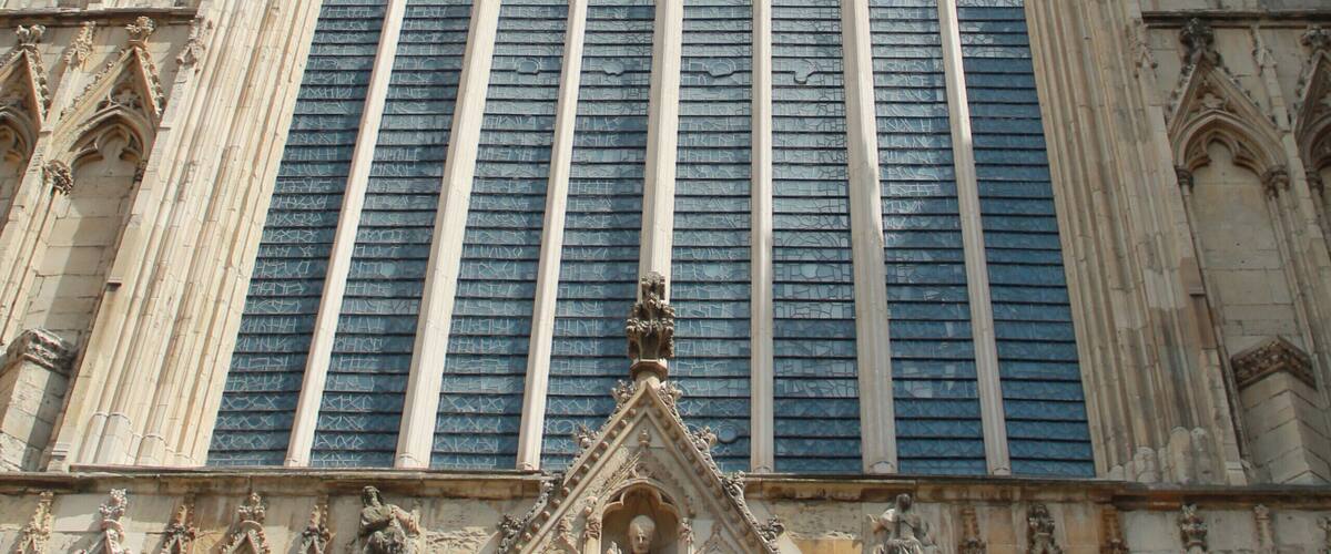 A Gothic cathedral with intricate stone carvings and a large rose window.