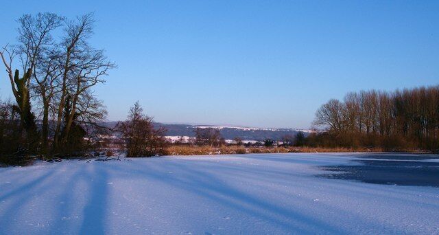 Newburgh Lake What lake? No liquid water visible, but a good covering of snow on top of thick ice. Southern edge of the Hambleton Hills in the distance.