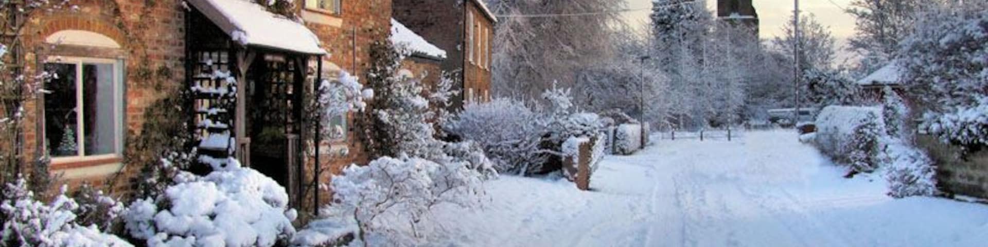 Wilberfoss in the snow. Middle Street Wilberfoss with the church over the Beck in the distance. See 399308