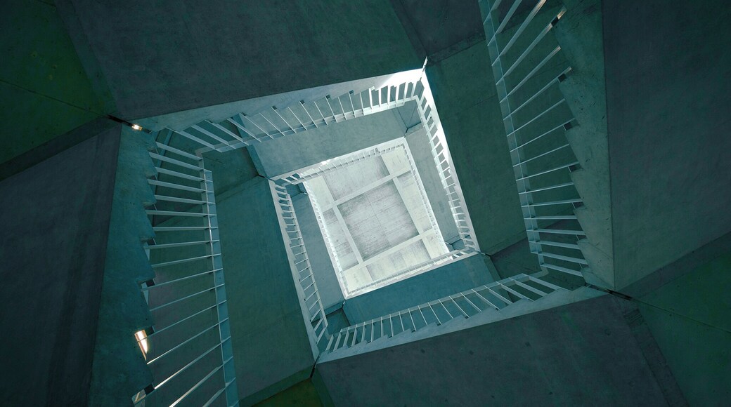 A staircase in the middle of the building, enjoy the spinning effect while looking upward