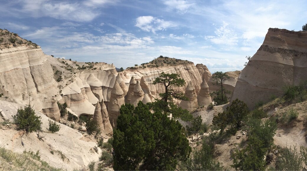 The Tent Rocks Canyon trail it is a hiking trail through a slot canyon with hoodos and striated rock formations. It's a nice climb, about 750 ft elevation increase in about 3 miles. Going though tunnels and up ledges. There are railroad ties to make steps to get to the top where you can see for miles! It is truly breathtaking!! #lifeatexpedia