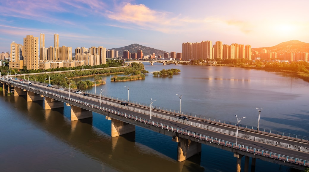 Aerial view of city skyline and modern buildings in bengbu at sunset, China.