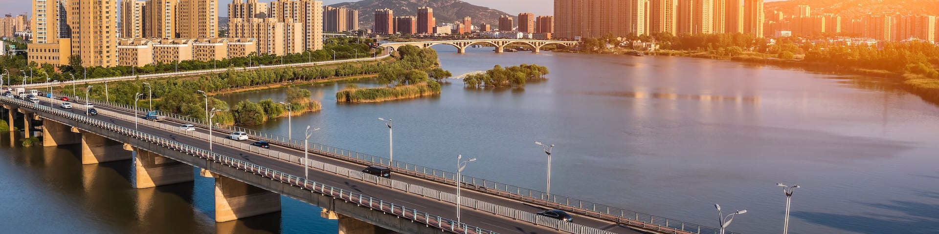 Aerial view of city skyline and modern buildings in bengbu at sunset, China.