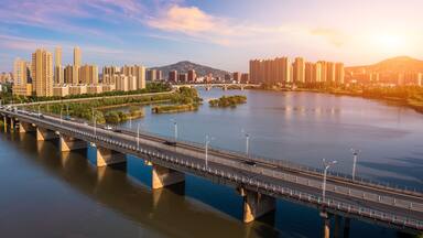 Aerial view of city skyline and modern buildings in bengbu at sunset, China.