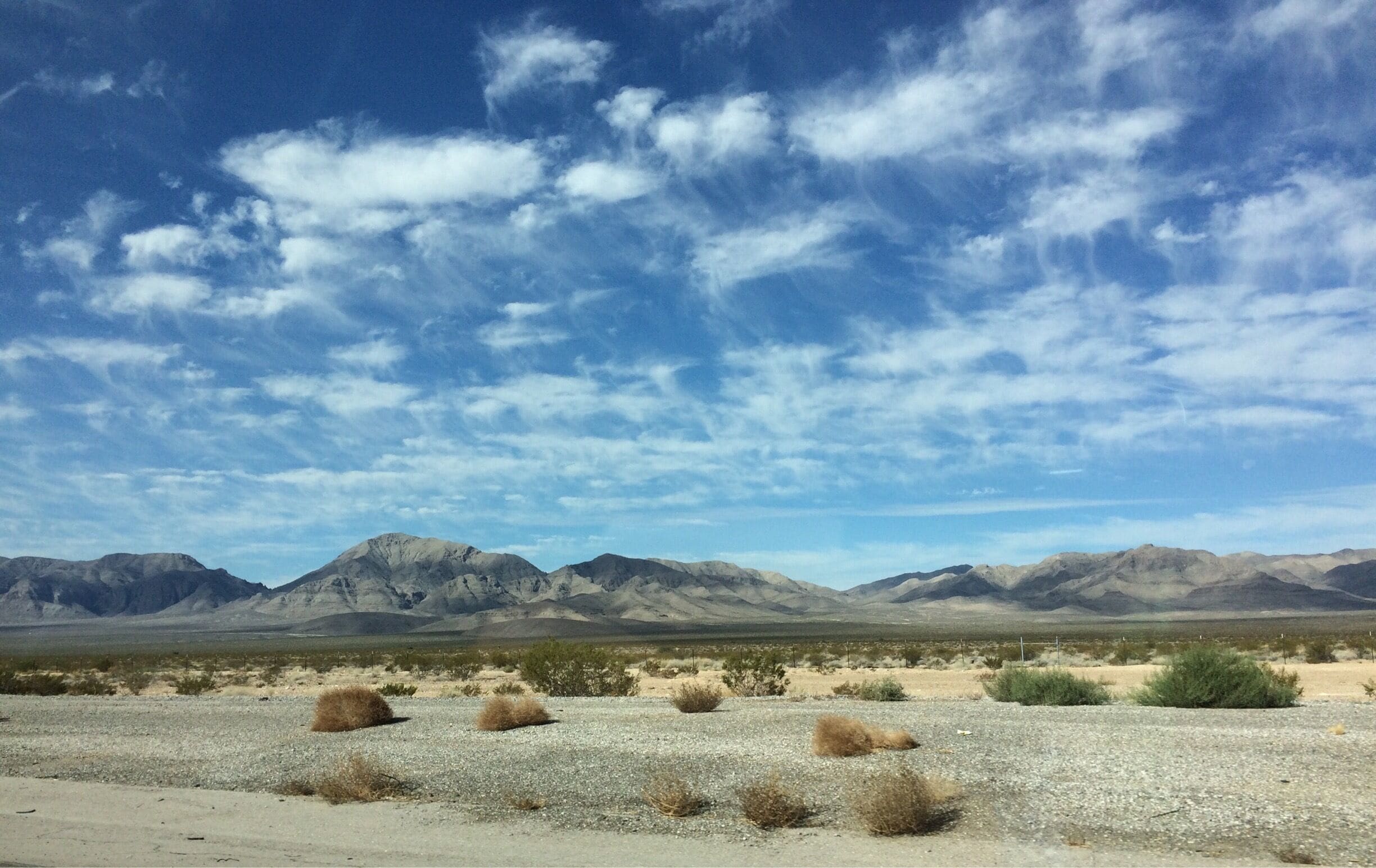 View of the desert and the Spring Mountain range from Interstate 15 south of Las Vegas on the drive to Los Angeles.  