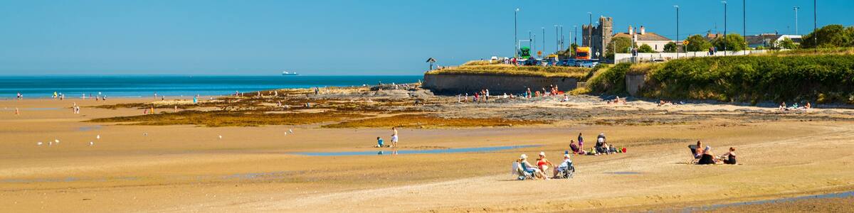 Malahide Beach which includes a sandy beach and general coastal views