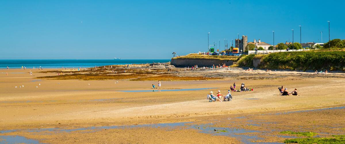 Malahide Beach which includes a sandy beach and general coastal views