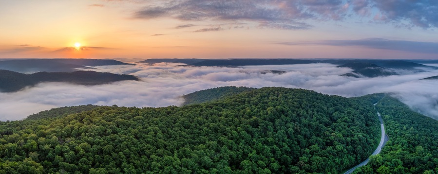 A foggy sunrise over the Arkansas Ozark Mountains - Calftail Cut on Hightway 43 near Centerpoint