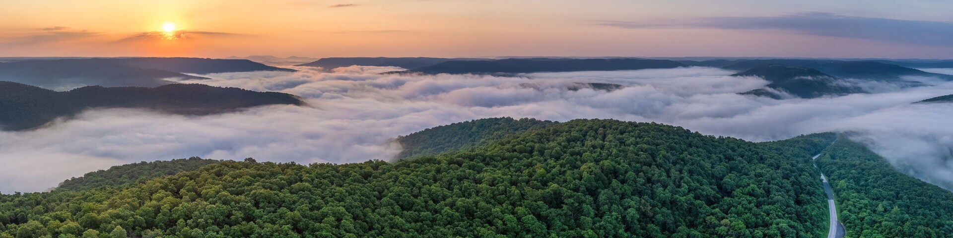 A foggy sunrise over the Arkansas Ozark Mountains - Calftail Cut on Hightway 43 near Centerpoint
