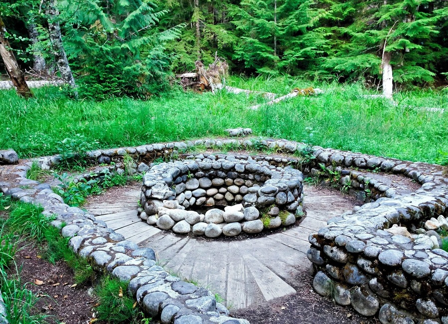 The remains of Soda Springs, one of 49 mineral spring that attracted visitors to this area in the late 1800s and early 1900s. The springs were developed by the Longmire family, who first settled the area in 1883 after building a wagon trail from Ashford, 13 miles (21 km) away. In addition to improving the springs, the Longmires constructed a series of cabins, tents, a 5-room hotel, and hiking trails to Paradise.
By 1915 the Longmires and the National Park were no longer seeing eye-to-eye, and the Longmires leased the property to a hotelier, who improved and continued to operate the springs until the National Park Service purchased the property in 1939. You can read a bit more about the area's history here: http://bit.ly/1vkU4C4
You can visit the remains of a few mineral springs and an 1888 cabin by hiking the short and flat Trail of Shadows loop (0.7 mi/1.1 km). It's an easy walk, and there's a nice view of Mount Rainier from the meadows.