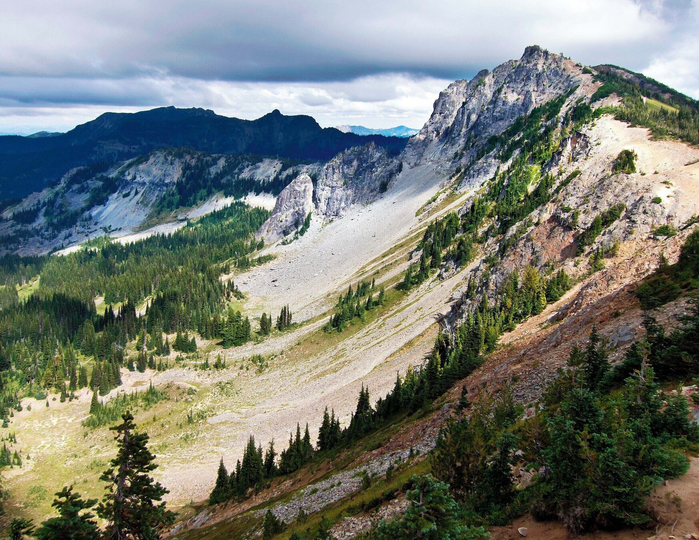 Stellar afternoon view of Sourdough Ridge and the Huckleberry Creek valley.  This moderate hike starts at the Sunrise visitor center and climbs 400ft (120m) up the ridge, offering sweeping views to the north and south before descending into a lush valley and back to the parking lot.
