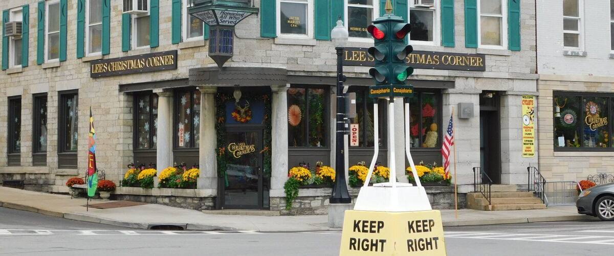 A building with a clock and signs reading "Lees Christmas Corner".