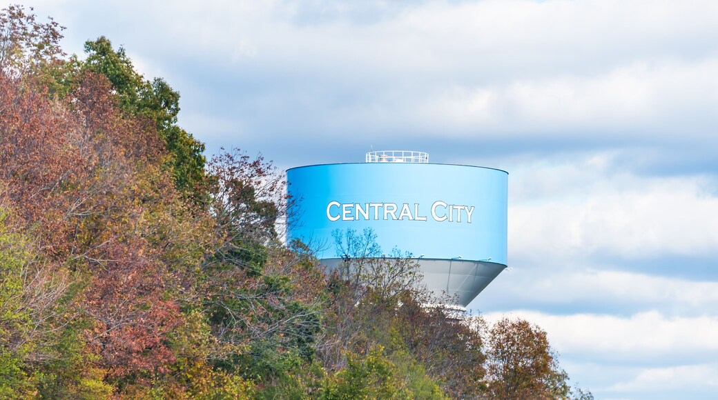 View of water tower sign for Central City in Kentucky countryside industrial town closeup and cloudy sky