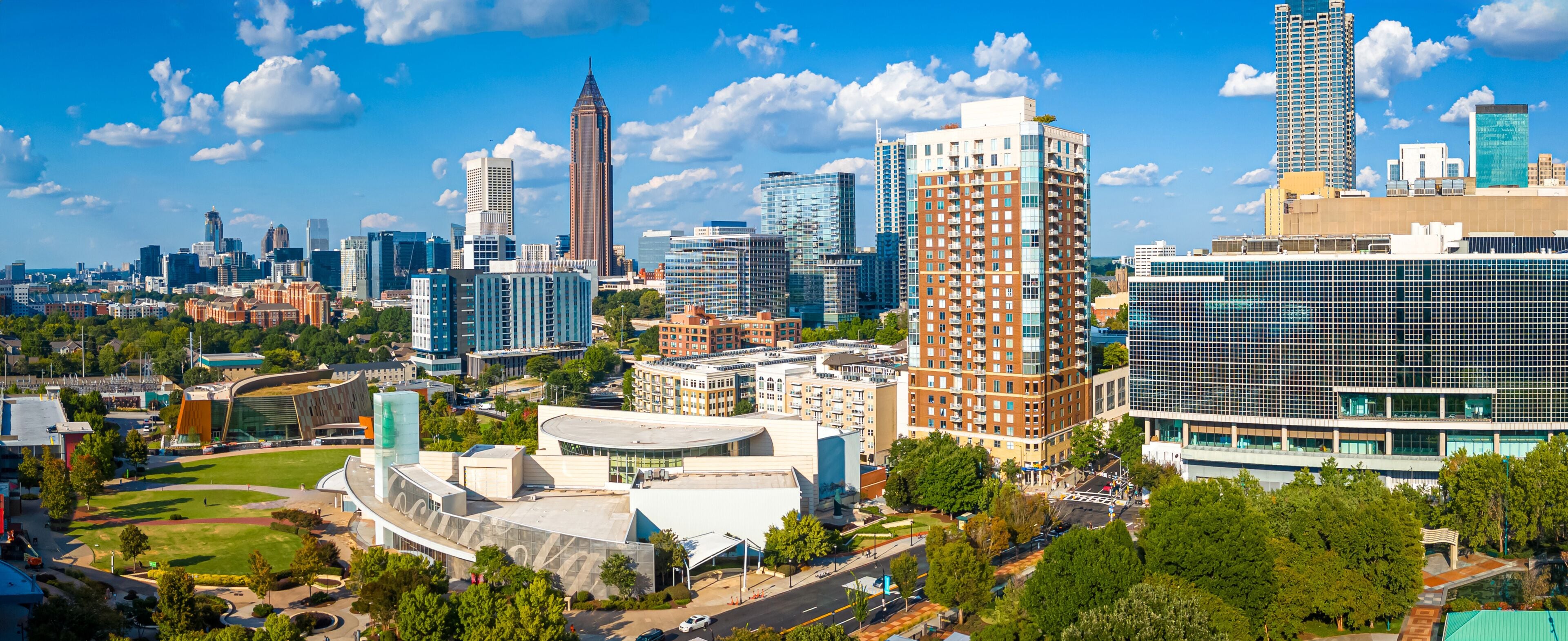 Atlanta Skyline with Midtown Towers Above Lush Urban Park in Summer Light