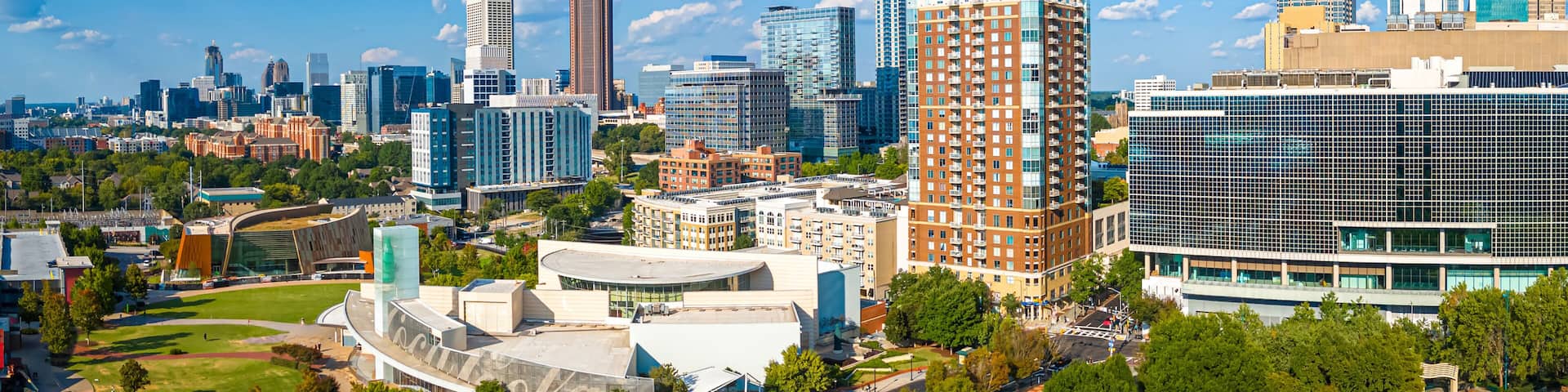 Atlanta Skyline with Midtown Towers Above Lush Urban Park in Summer Light