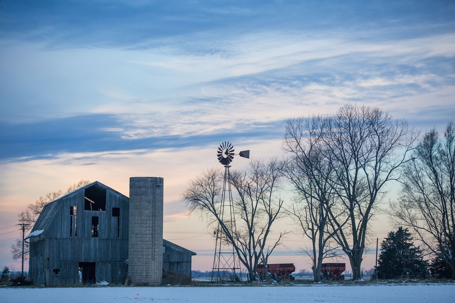 Cloudy Winter Dusky Sky over Old Derelict Farm and Windmill.