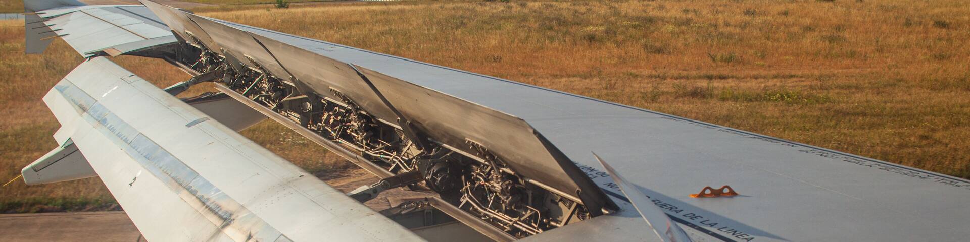 Commercial jet wing deploying flaps on landing at Orly Airport, Paris