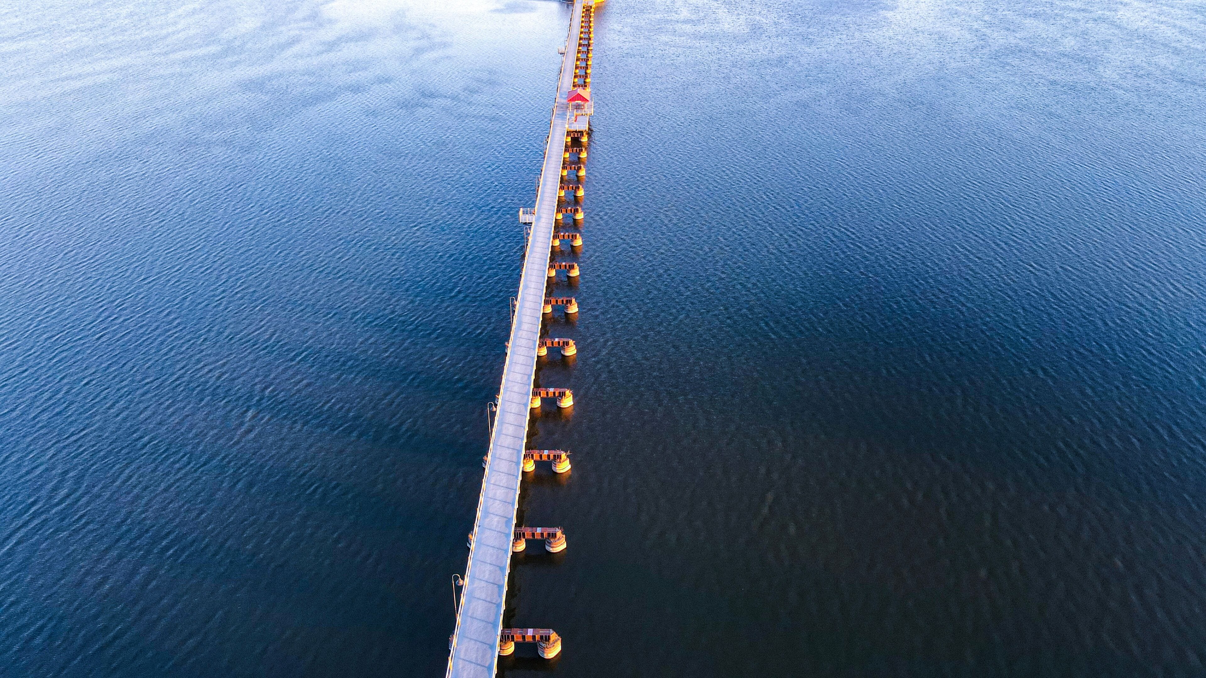 Trestle trail in neenah wisconsin extends over a small lake to another city