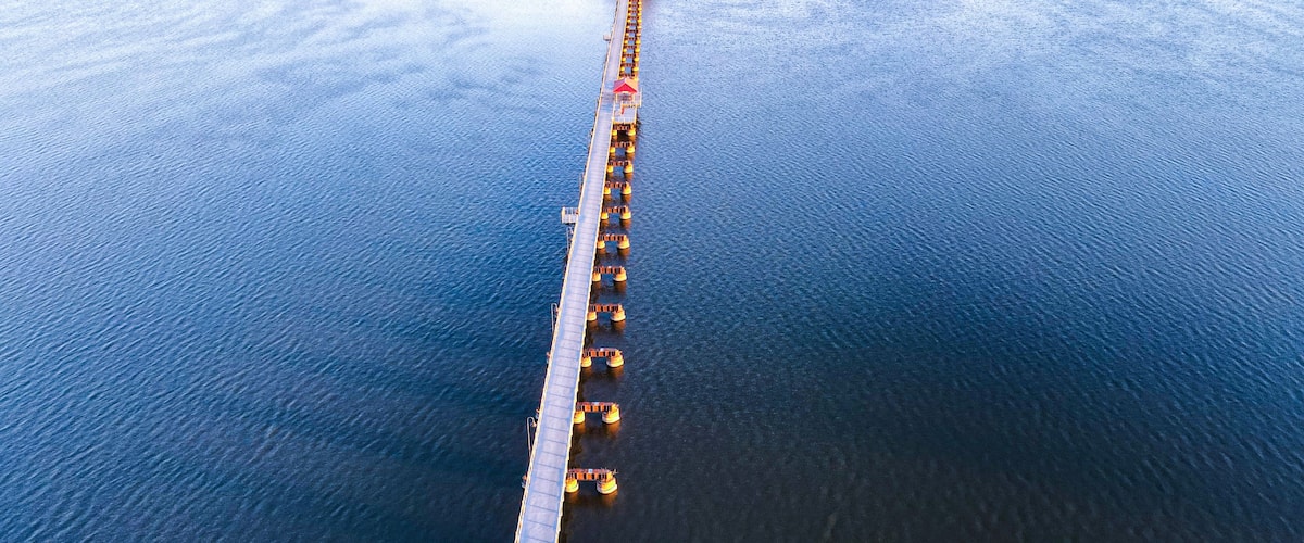 Trestle trail in neenah wisconsin extends over a small lake to another city