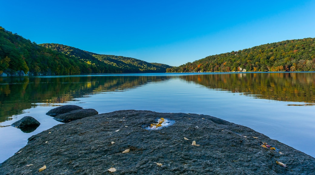 Squantz Pond New Milford Connecticut. Clear Blue Sky and still reflective waters