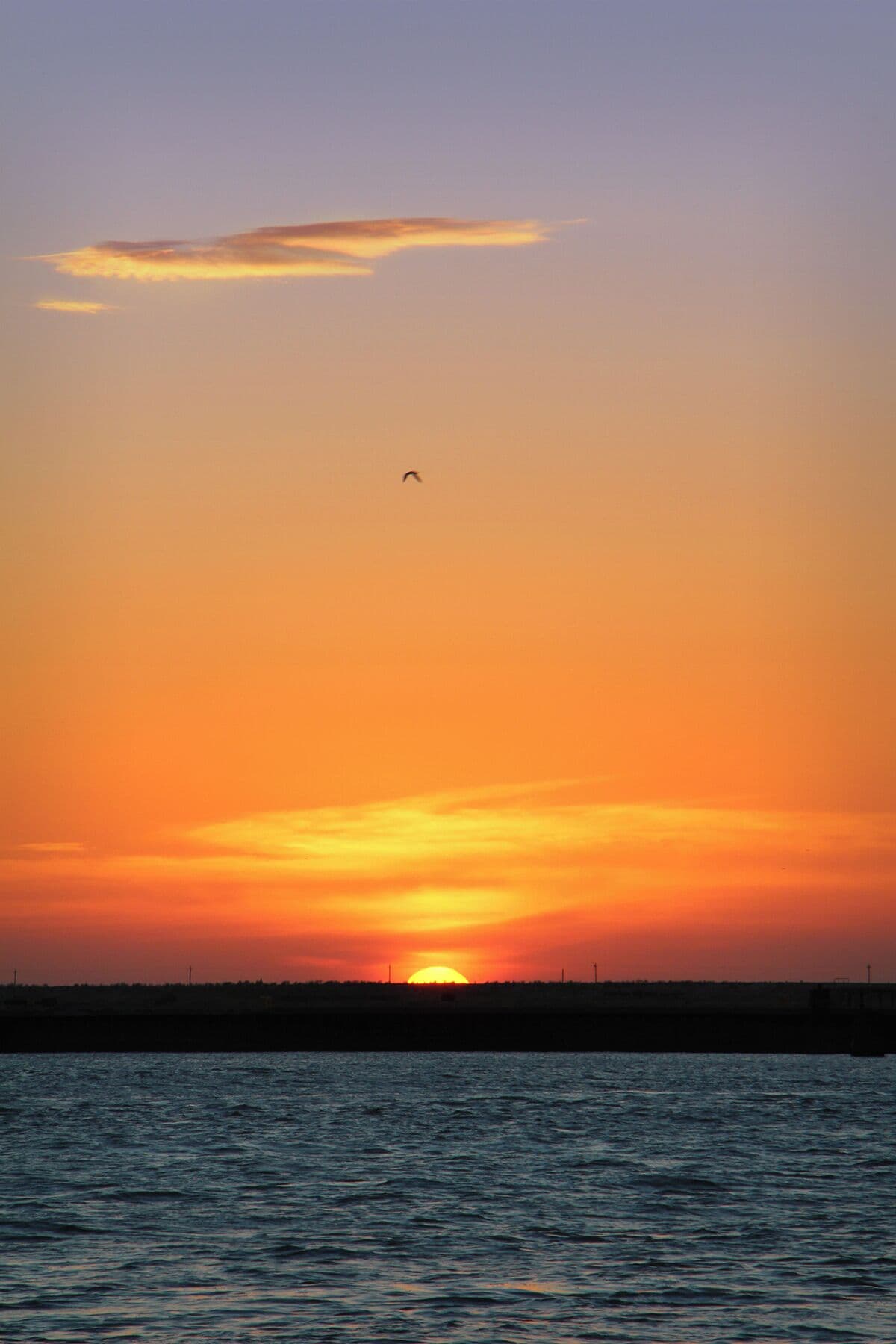 Brilliant orange sunset on a Saturday evening looking across Aransas Pass. #sunset #beachbound