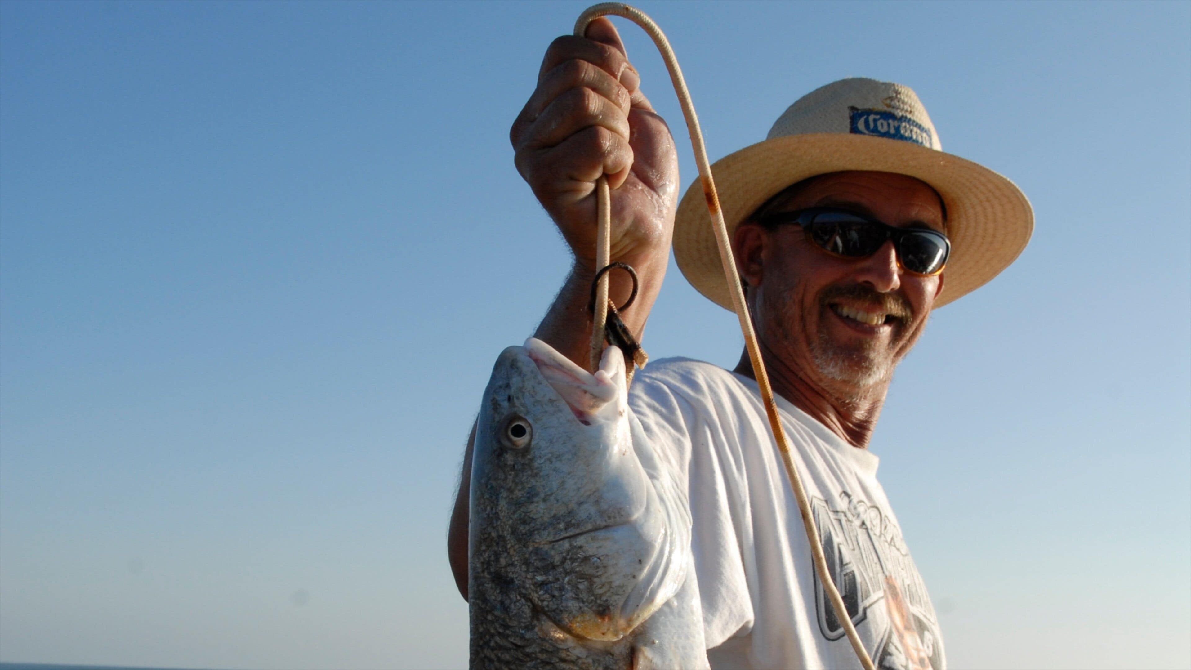 Port Aransas which includes fishing and food as well as an individual male