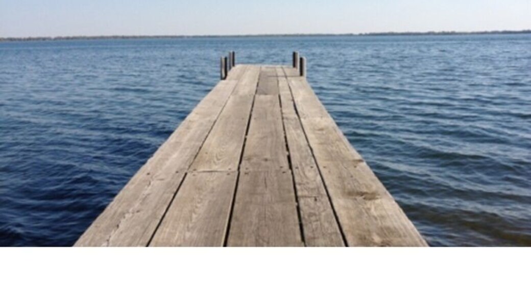 Iowa's largest natural lake. Part of the Iowa Great Lakes resort region. #lake #dock #iowa #travel #explore #water