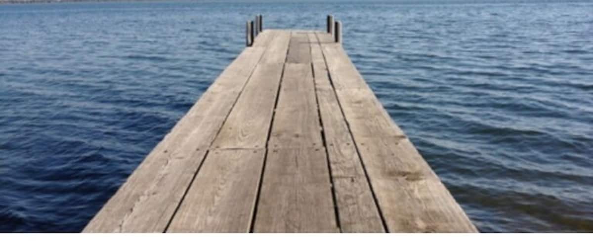 Iowa's largest natural lake. Part of the Iowa Great Lakes resort region. #lake #dock #iowa #travel #explore #water