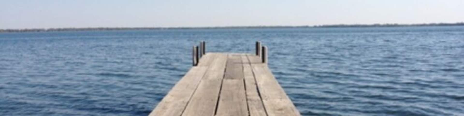 Iowa's largest natural lake. Part of the Iowa Great Lakes resort region. #lake #dock #iowa #travel #explore #water