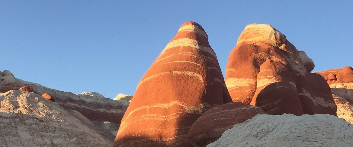 A desert landscape with prominent rock formations.