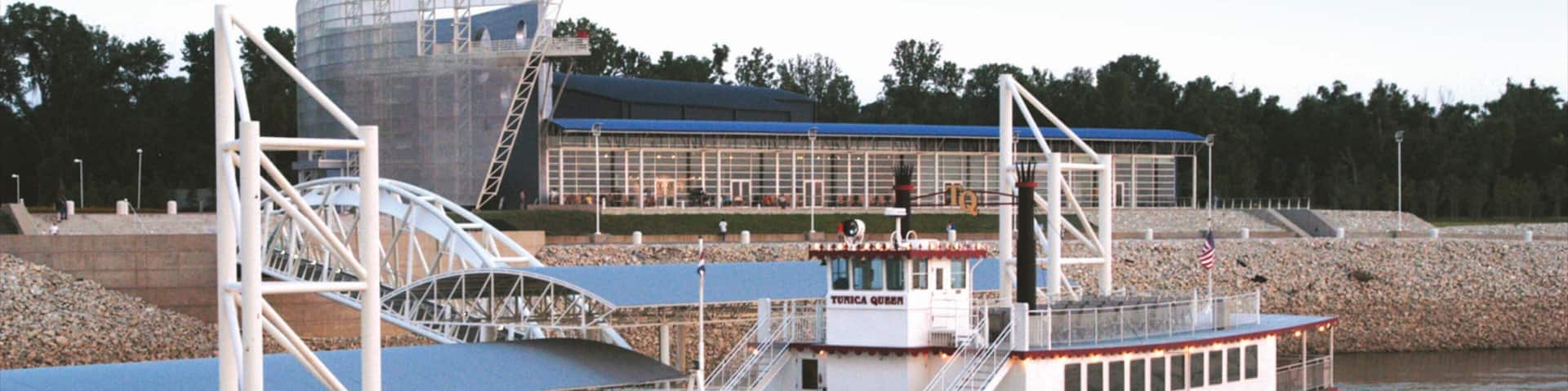 Tunica showing a coastal town and a ferry