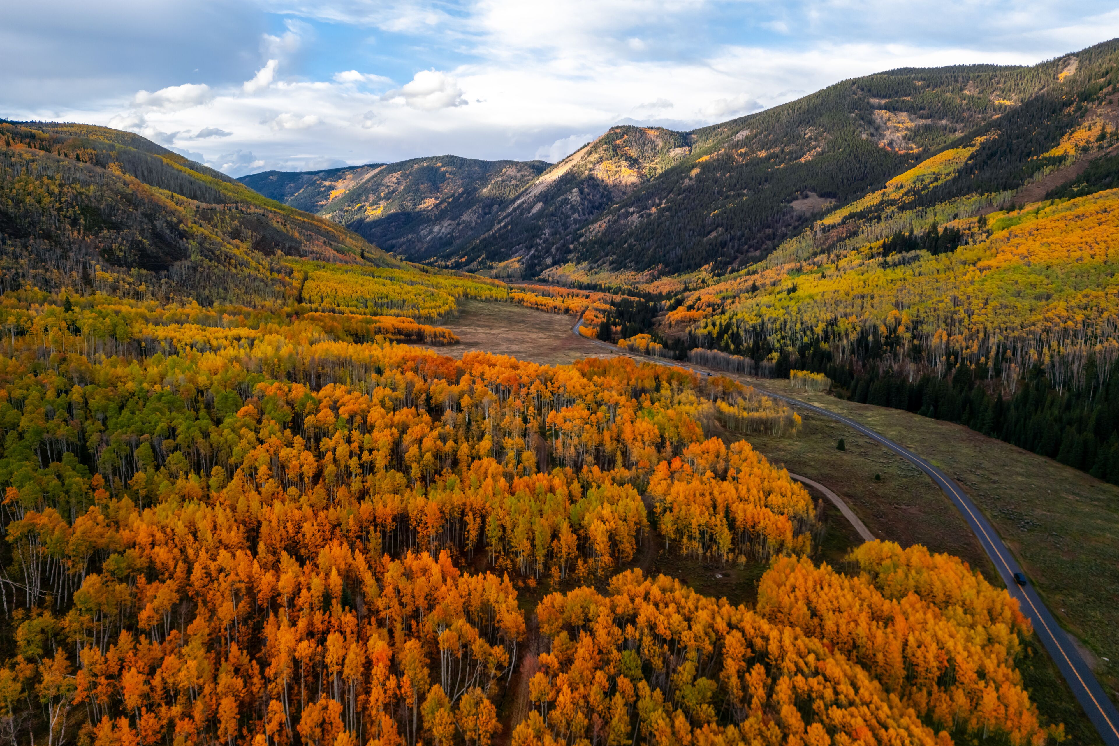Scenic landscape of Crystal Creek river valley in Colorado during autumn time.