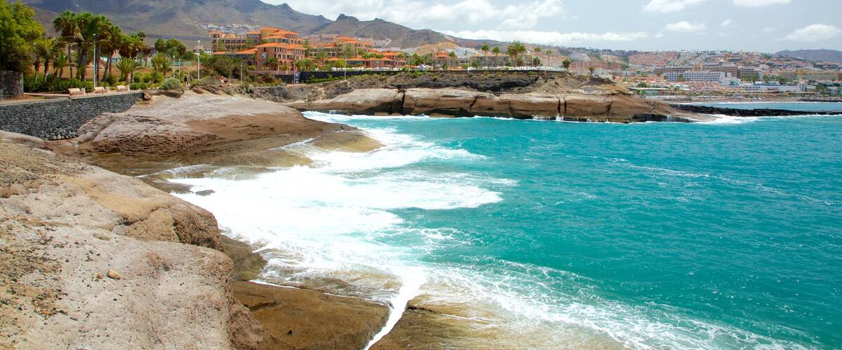 Adeje showing rocky coastline and mountains