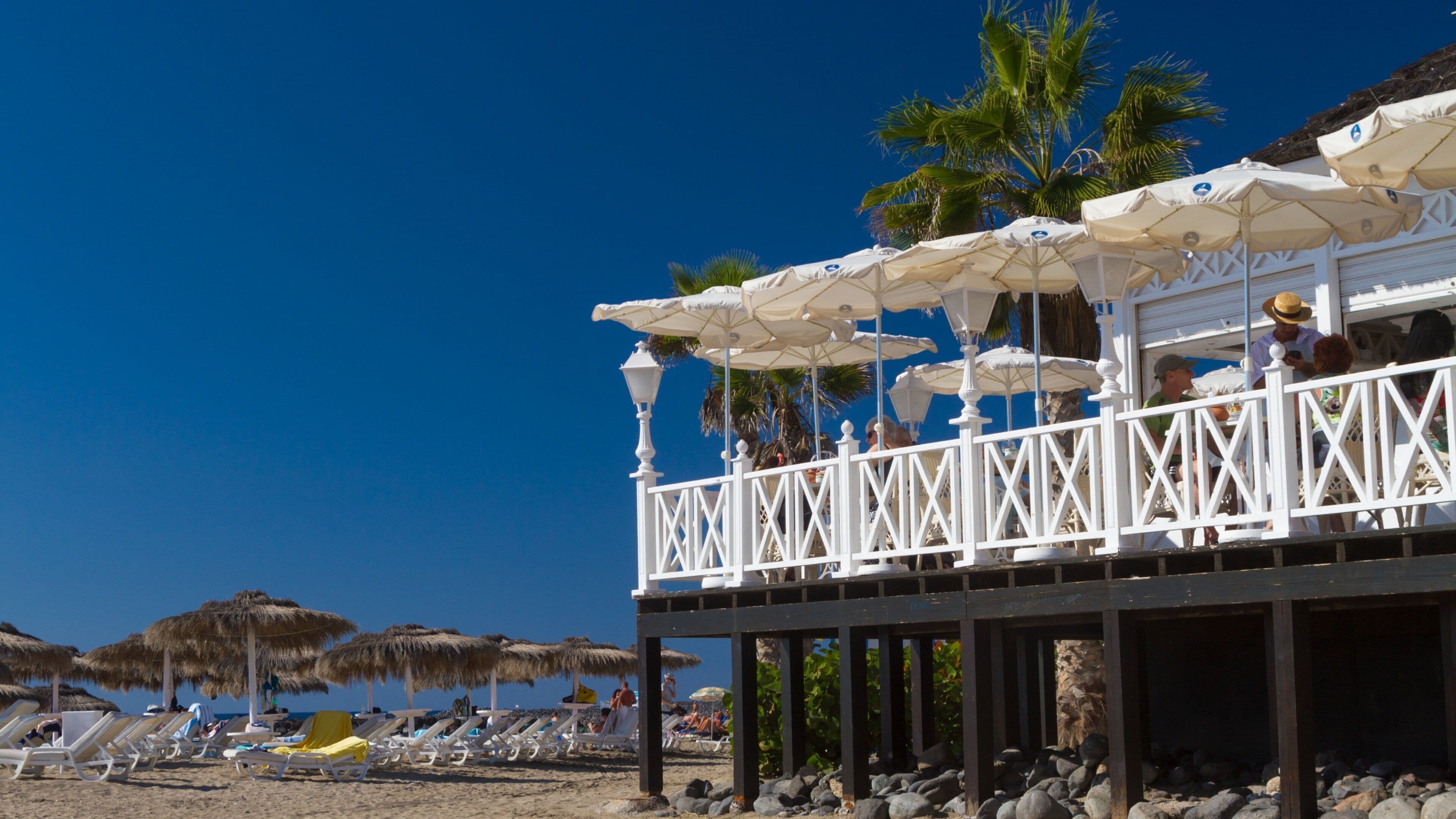 Adeje featuring a luxury hotel or resort and a sandy beach